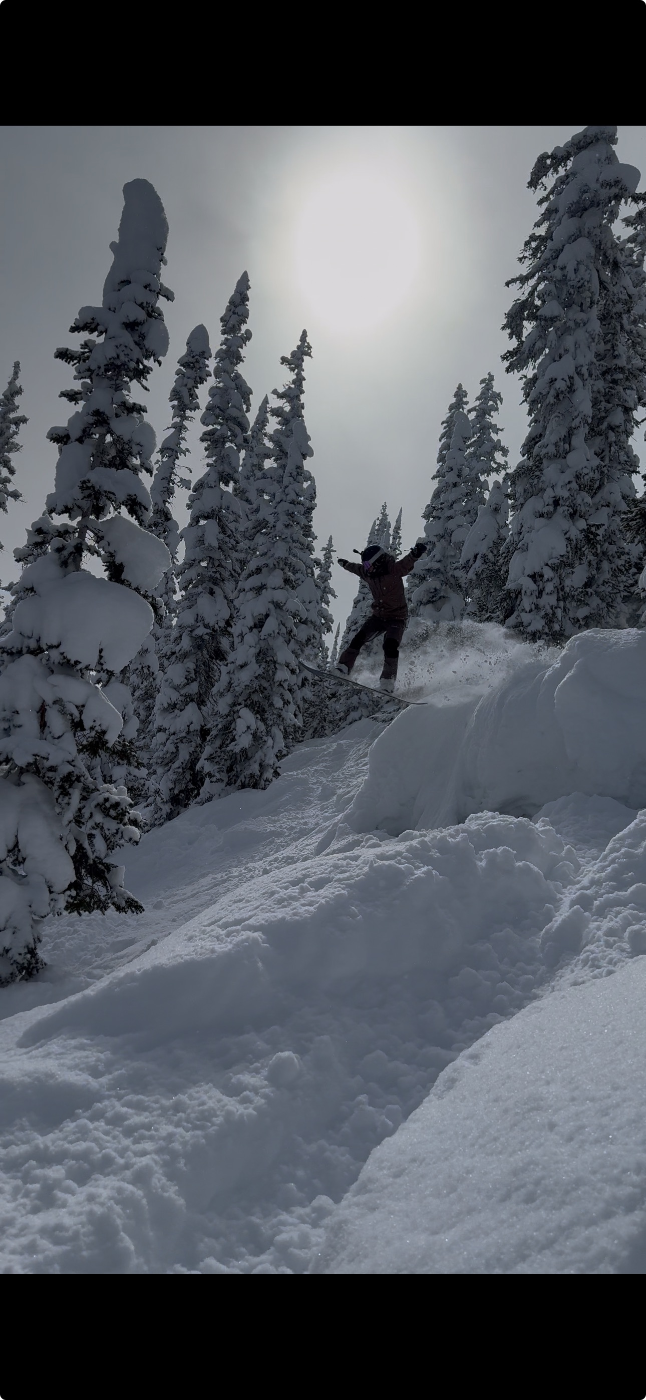 Eli mid-air on a snowboard